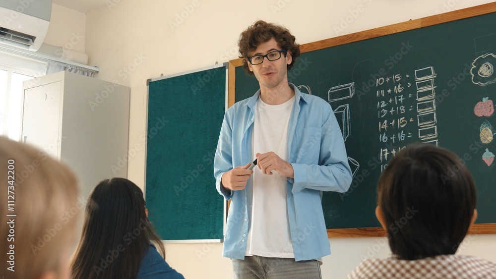 Poster professional mentor looking around classroom while standing in front of blackboard with math formula
