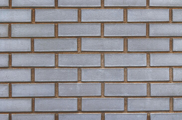 Grey brick wall facia closeup background
