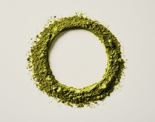 A top-down view of matcha powder being arranged, showcasing its rich green color and culinary applications.