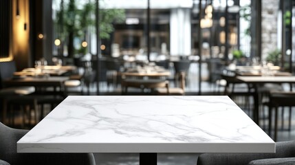 Elegant marble table top in modern cafe interior featuring blurred dining area ideal for product display and promotional montages.