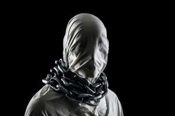 Portrait of a scary ghost with chains isolated on black background with clipping path