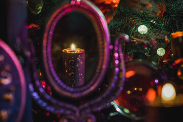 Rite with a burning candle, night mystery atmosphere, Christmas eve, Yule or another day