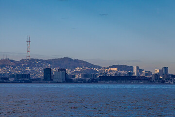  A panoramic view of the South San Francisco skyline, featuring prominent landmarks such as Oracle Park on the right and Sutro Tower in the background.