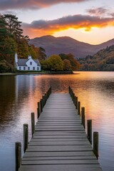 Obraz premium Picturesque sunset over tranquil lake with wooden dock
