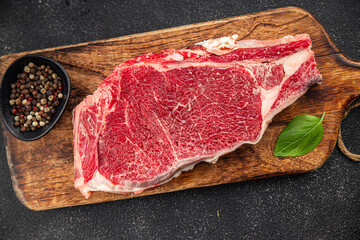 Raw beef steak meat fresh tasty food dish delicious gourmet food background on the table rustic...