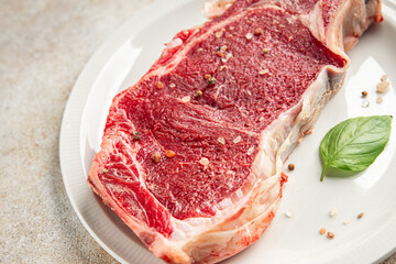 Raw beef steak meat fresh tasty food dish delicious gourmet food background on the table rustic food top view copy space keto and paleo diet