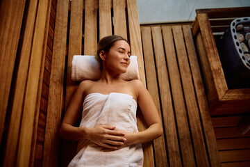 Above view of relaxed woman in the sauna.