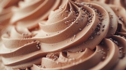 Close-up of chocolate mousse texture with swirls and sugar sprinkles. Dessert and gourmet food concept