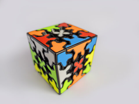 Braunschweig, Germany - December 10, 2024: type of Rubik's cube - Qiyi Crazy Gear Cube, Gear Puzzle, Raphael Puzzles