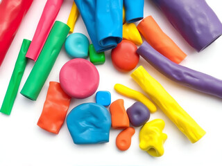 Colorful play dough toys arranged on a white background, showcasing a variety of shapes and vibrant hues.
