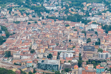 Obraz premium Breathtaking aerial view of ancient city center of Trento nestled in Trentino Alto Adige, Italy. Vantage point from Terrazza Panoramica Busa Degli Orsi. Tourist destination. Popular landmarks of town