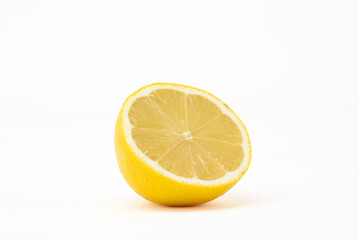 A vibrant, juicy lemon captured in front view, showcasing its bright yellow color and detailed