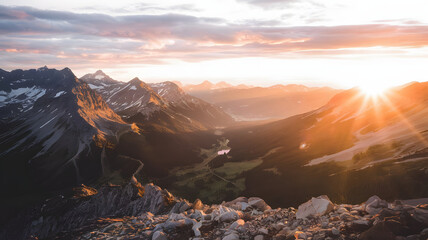 Obraz premium A sunset view from a mountaintop, with golden light spreading across the valley below