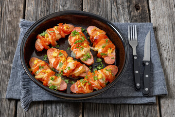 hot sausages baked with cheese, tomato, mustard