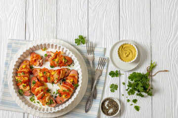 hot sausages baked with cheese, tomato, mustard