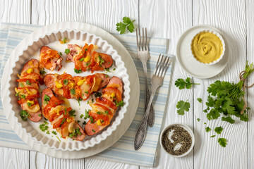 hot sausages baked with cheese, tomato, mustard