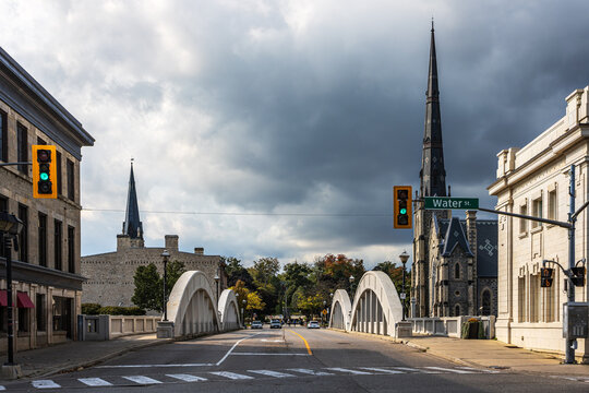 Cambridge Main Street Bridge in a cloudy autumn day, with downtown churches and the bridge arches.
