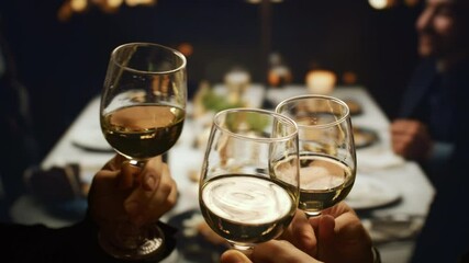 Friends Toasting White Wine Glasses At Dinner Party Social Gathering Celebration