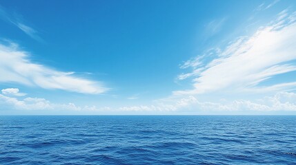 Obraz premium Vast blue ocean and sky under bright sunlight with scattered clouds