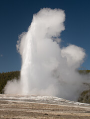 Old Faithful geyser erupting, Yellowstone National Park.