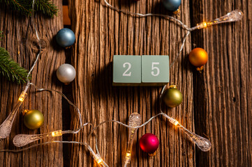 Wooden calendar set on the 25 of december. Christmas concept