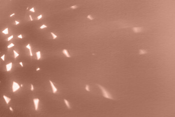 Demonstrating color of the year 2025. Mocha mousse color swatch. Light crystal leak overlay background. Prism glass flare effect texture. Sunlight rays
