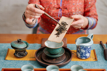Delicate tea brewing process celebrated in an intimate and cultural setting