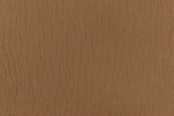 Detailed texture of rough fabric in brown, captured up close, highlighting its natural appearance