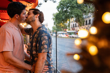 Romantic moment between a gay couple on a city evening