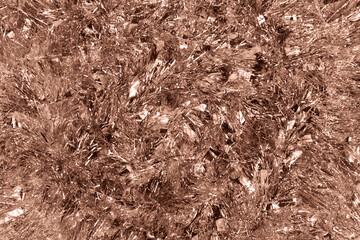 Christmas background with tinsel. Demonstrating color of 2025 year mocha mousse