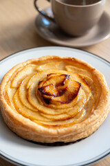French fresh baked sweet puff pastry with fresh apple fruits in sirup  in confectionery shop