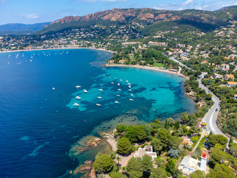 Panoramic view from above on blue Mediterranean dea, sandy beach of Agay town, summer vacation destination near Esterel mountains, French Riviera, Provence. France