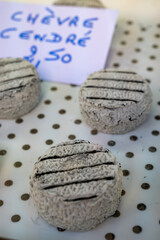 Cheese collection, French Cendre Lait cru Chevre cheese made from goat milk with ash in Souillac, Perigord region in France