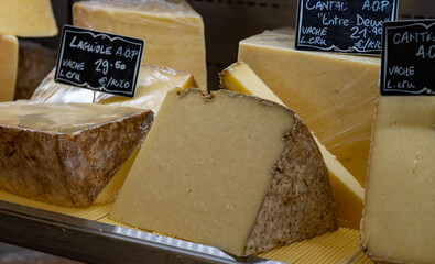 Cheese collection, hard French cheese old cantal fermier made from raw cow milk with rind close up