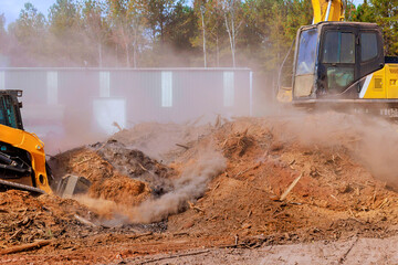 Bulldozer is leveling ground earthmoving on construction site for preparation of grading soil for...
