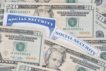 New and Old style Social Security cards with 20 dollar bills. SS number is a nine digit number...
