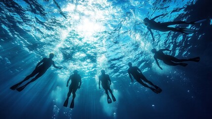 Fototapeta na wymiar A diver's silhouette descending into the blue ocean depths among fish and corals illuminated by sunbeams
