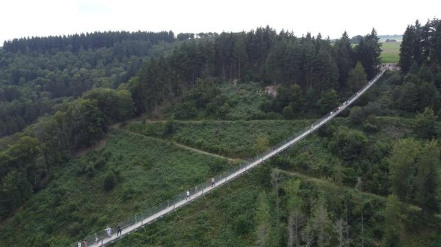 M&ouml;rsdorf, Germany - August 19th 2024: Drone flying away from the Geierlay Suspension Bridge.