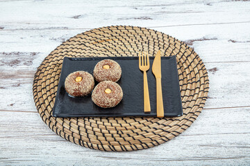 Traditional Turkish Dessert Sekerpare is also known as Chocolate Sekerpare with White Poppy Seeds,...