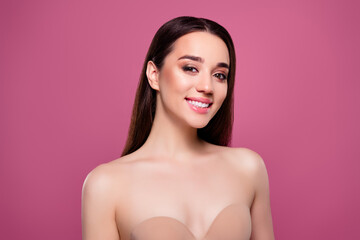 Photo of tempting shiny woman naked shoulders taking care breast health isolated pink color...