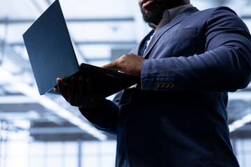 IT operative in data center implements backup solutions to protect against equipment data loss...