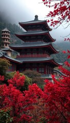 pagoda in the middle of a mountain with red flowers