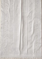 Obraz premium Vintage-inspired white beach towel with intricate patterns and decorative stitching, coastal, linen
