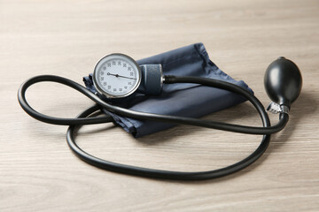 Blood pressure measuring device on wooden table