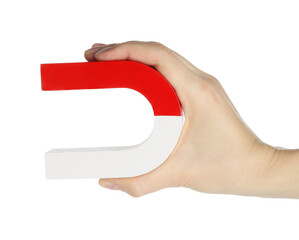 Woman with horseshoe magnet on white background, closeup