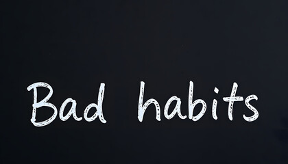 Obraz premium Paper note with phrase Bad habits on black board, closeup. Space for text isolated with white highlights, png