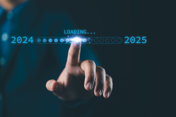 Businessman touches a digital progress bar indicating the transition from 2024 to 2025, symbolizing strategic planning, future readiness and challenge strategy for business startup.