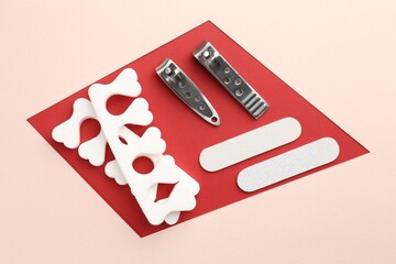 Set of pedicure tools on color background, flat lay