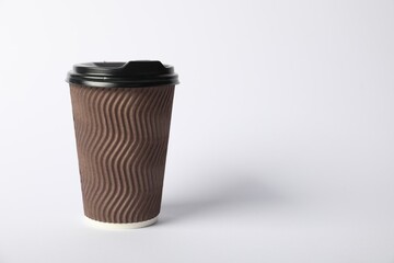 Paper cup with lid on white background. Mockup for design