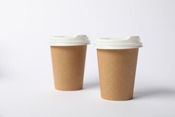 Paper cups on white background. Mockup for design